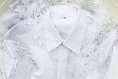 white shirt soaked in soapy water