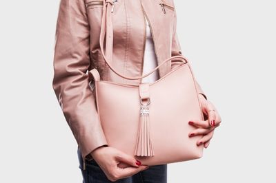 pink faux leather jacket and purse