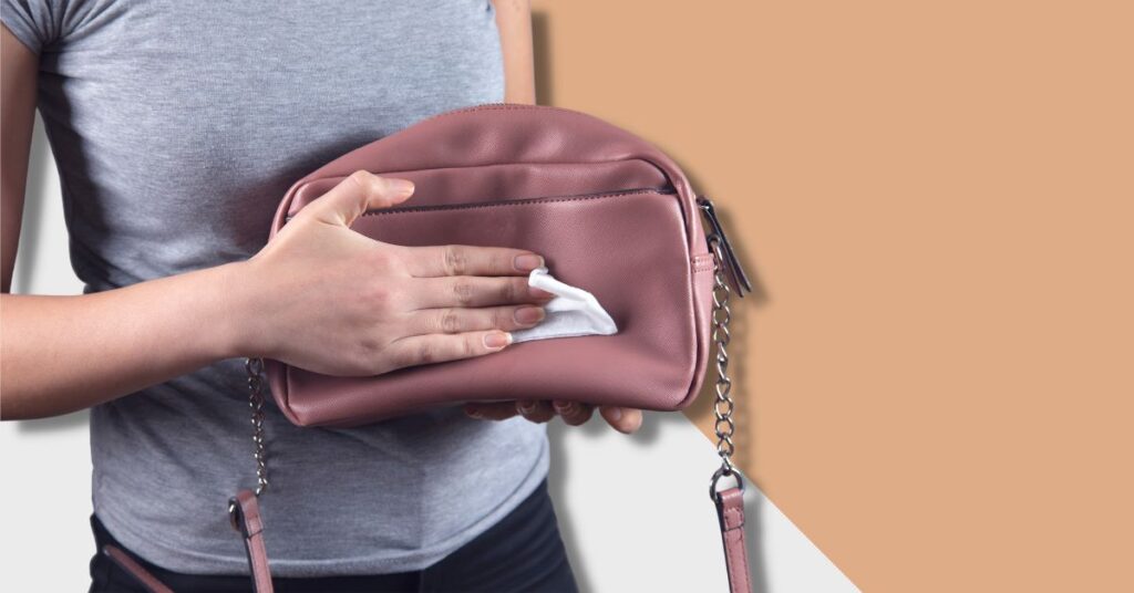women cleaning faux leather purse