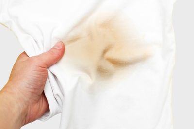 women holding e-liquid stained white shirt 