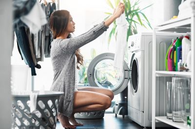 women checking for stains on clothes