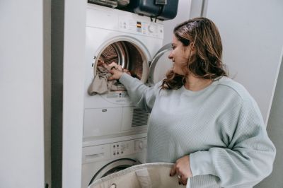 women loading washing machine