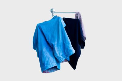 wet clothes are hanged on the dryer