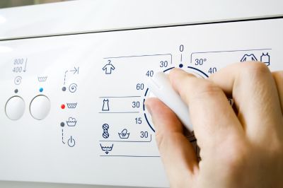 adjusting washing machine temperature knob