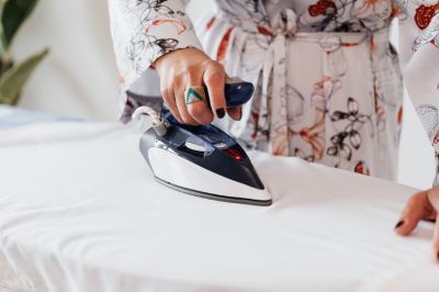 ironing clothes with modern iron