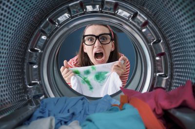 women holding stained clothes