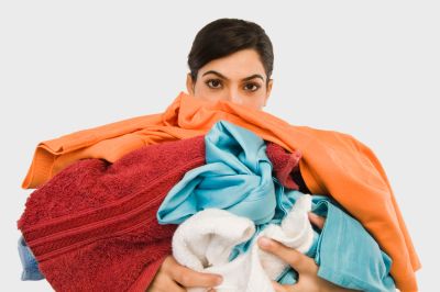 women taking bright clothes to colorfastness test